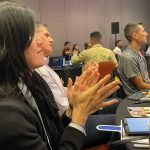 Clapping Audience Members in RevOps presentation by speaker Sandy Robinson